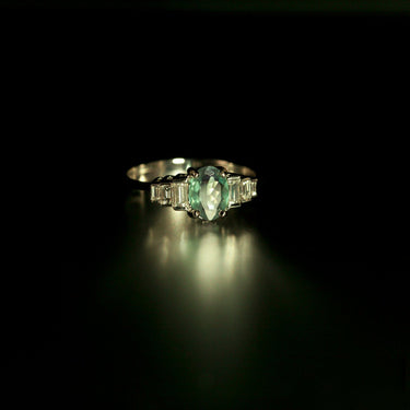 0.71ct natural alexandrite oval gemstone ring set in 18k white gold with six baguette diamonds